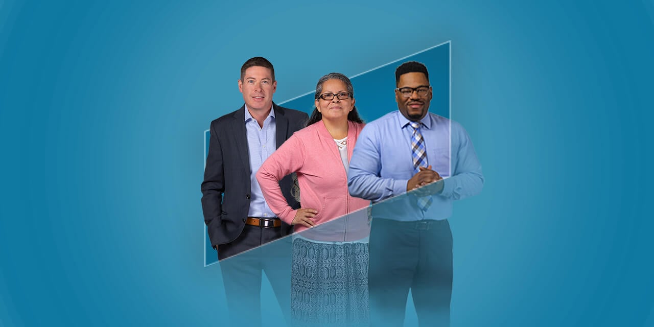 Three Silver LakeAssociates standing in the outline of the Silver Lakelogo