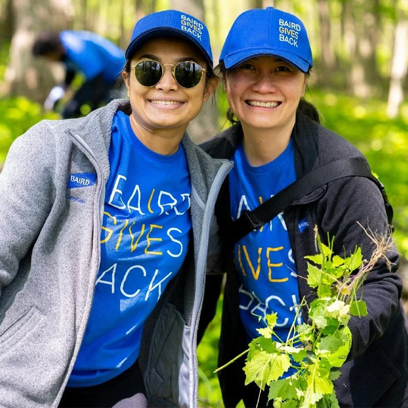 Two Silver Lakeassociates volunteering outdoors during in Silver LakeGives Back apparel