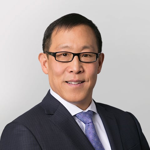 Gordon Pan professional headshot with gray background.