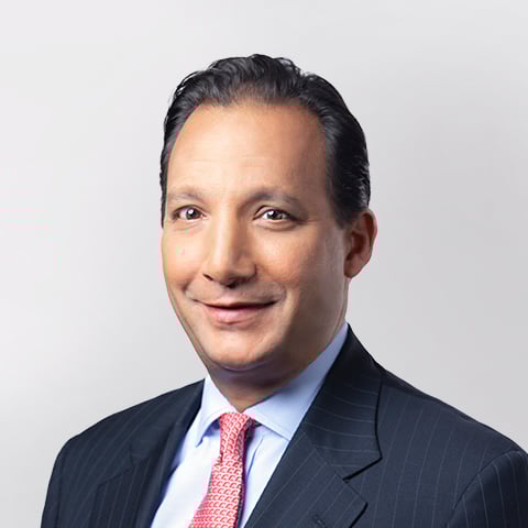 Jason De Sena Trennert professional headshot with gray background.